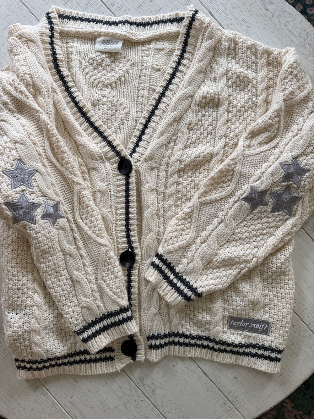 Taylor Swift Cream Cable Cardigan with Black Trim and Gray Star Patches